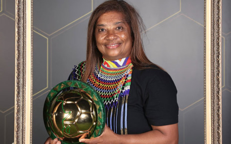 Minister Maite Nkona-Mashabane congratulates Desiree Ellis on her third caf coach on the year award