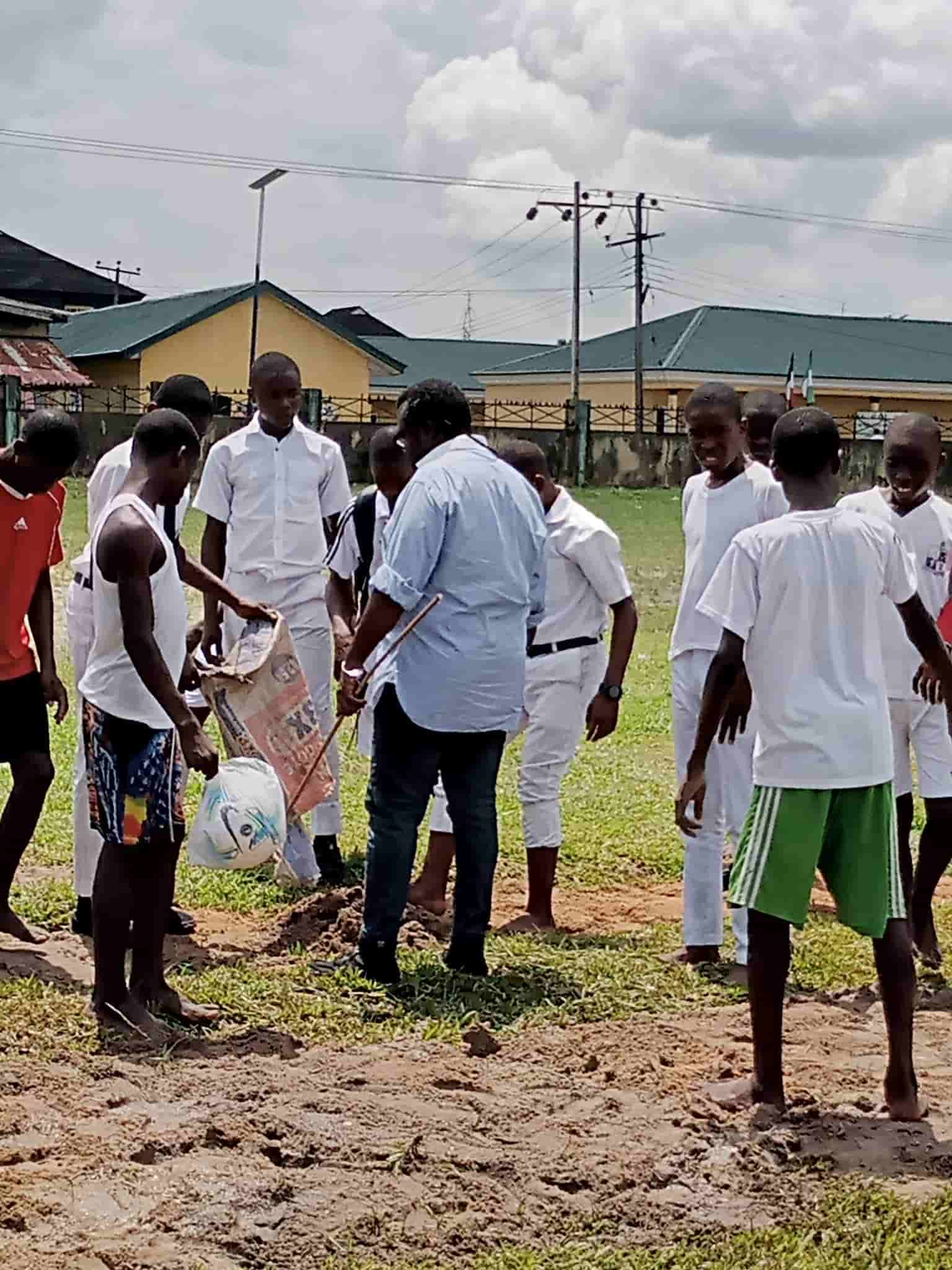 Buguma teacher teams volunteers to repair football pitch, Image: Facebook