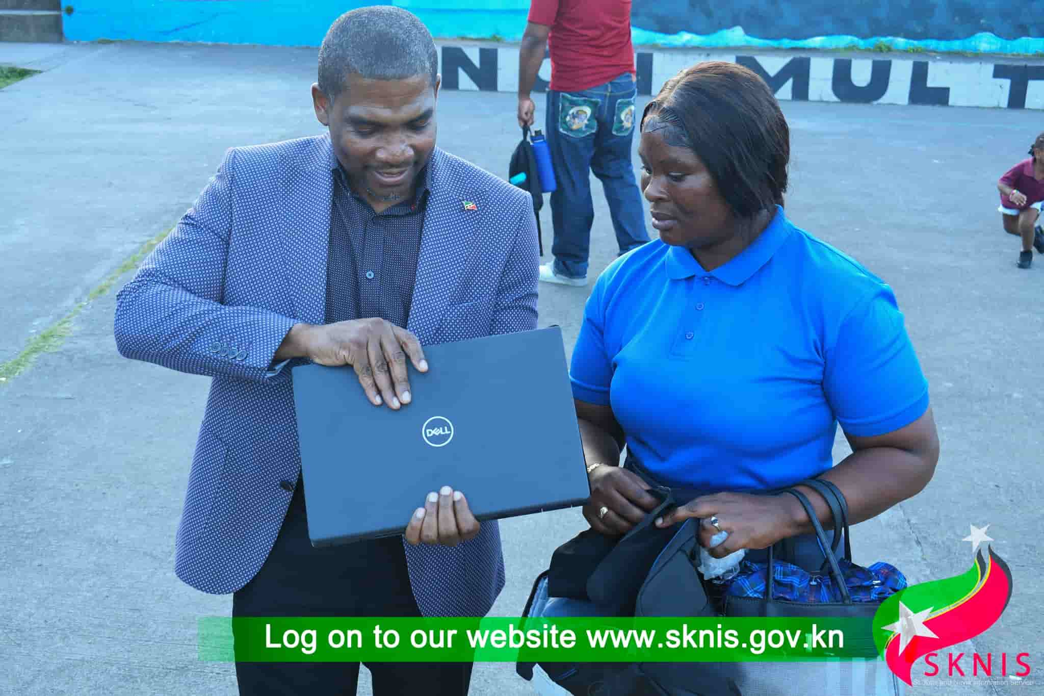 PM Terrance Drew donating laptops to Cayon High school, Image: facebook