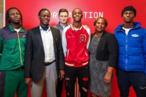 Junior Kuzanga with other team officials while signing as new team player for Southampton FC