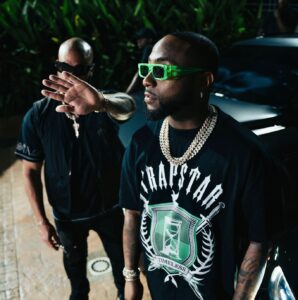 Rapper Davido in Trapstar London clothing posing for photograph