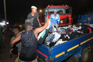 Shop Owners moving out clothing stuff from the Shopping Mall