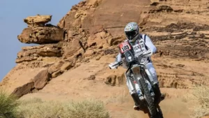 Zimbabwean Motorbike Rider Ashley Thixton while riding bike in sand dunes