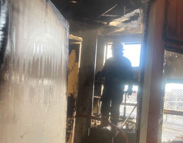 Firefighters while examining the cause of fire at Khayelitsha Library