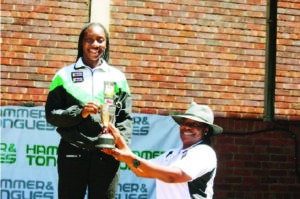 Vhenekai Dhemba receiving the award as a captain of Harare swimming team 