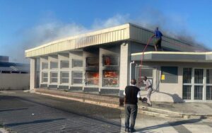 Firefighters while trying to extinguish the fire at Khayelitsha Library 