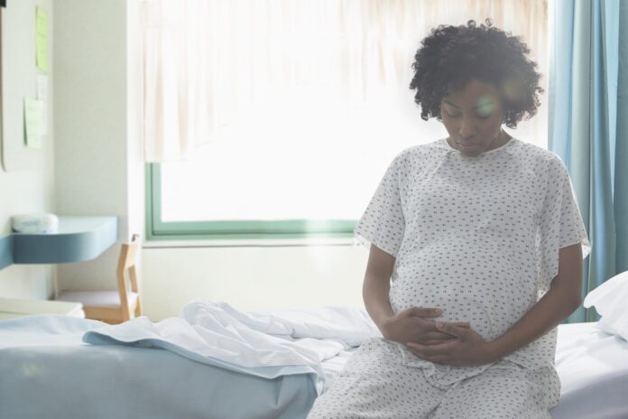 Representative image of a young pregnant lady in labour pain