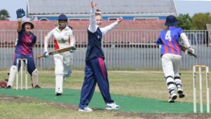 Players playing cricket at Power Play Tournament