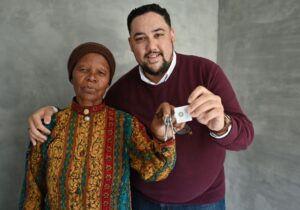 Carl Pophaim while handing over the house keys