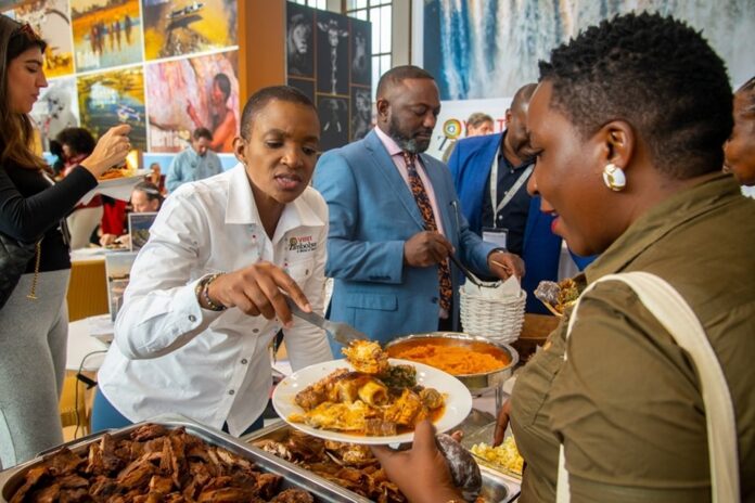 Minister of Tourism Barbara Rwodzi while showcasing rich cuisines of Zimbabwe during ITB Berlin 2024