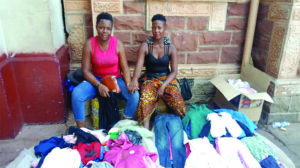 Grace Tshuma and Dazline Masukume selling second hand clothes