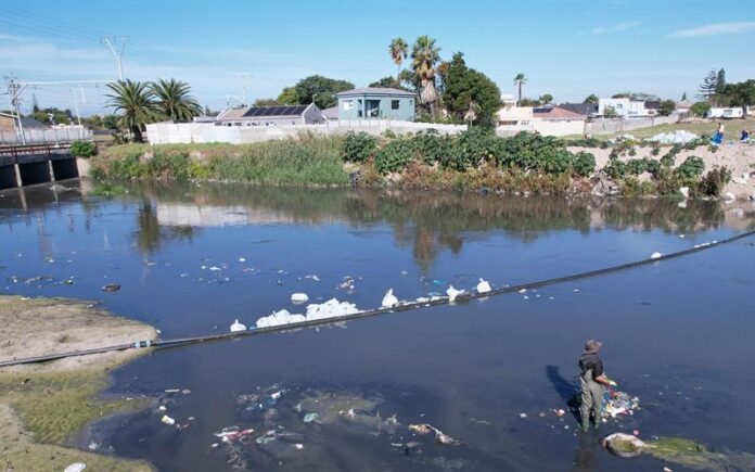 Photograph representing water pollution in Black River