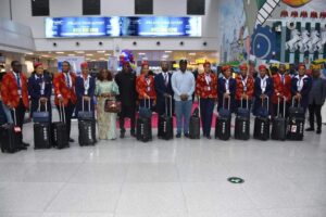 Officials with the passengers and team at the United Nigeria Airlines