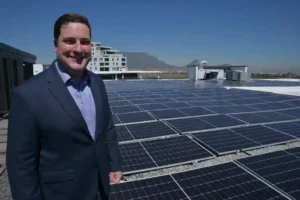 Mayor Geordin Hill Lewis   with solar panels, for 'Cash for Power' programme 