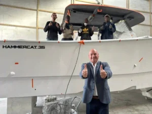 Alderman James Vos with officials of Hammer Yachts  