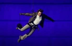 Tom Cruise while landing on the stage at Paris Olympics Farewell