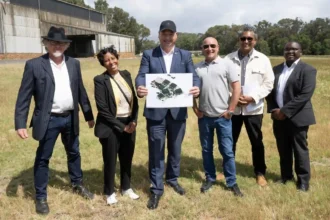 Alderman James Vos with Cape Point Film Studios team at construction site of new film set