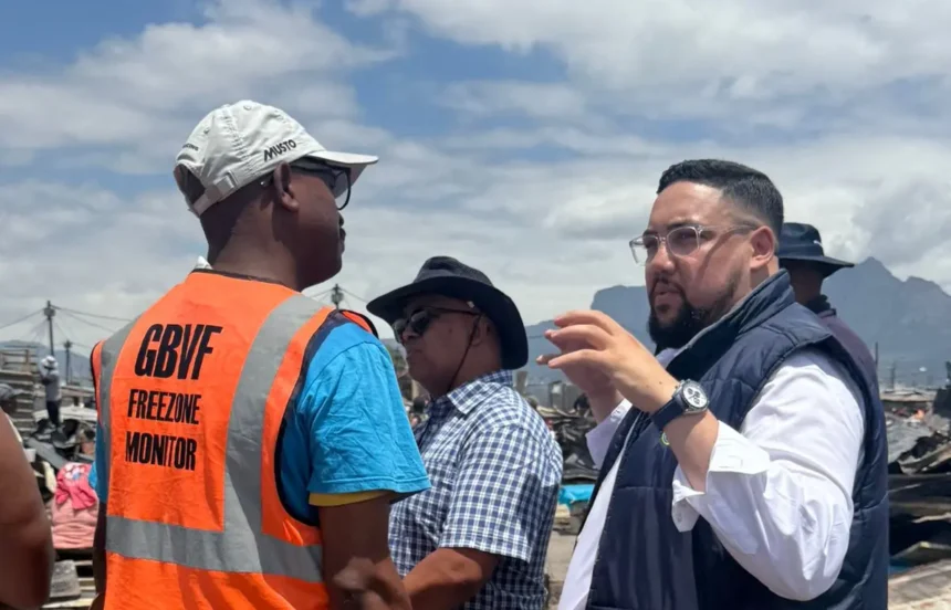 Councillor Carl Pophaim while examining the fire affected site in Cape Town