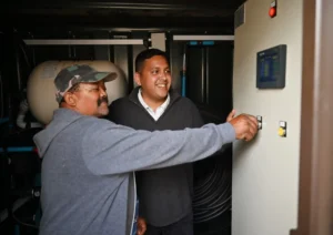 Councillor Zahid Badroodien with the team at handover ceremony of the self-sustaining toilet systems 