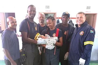 Mfuleni Fire Station firefighters with the healthy baby boy they delivered