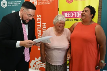 Councillor Carl Pophaim with Leonsdale Title Deeds recipients