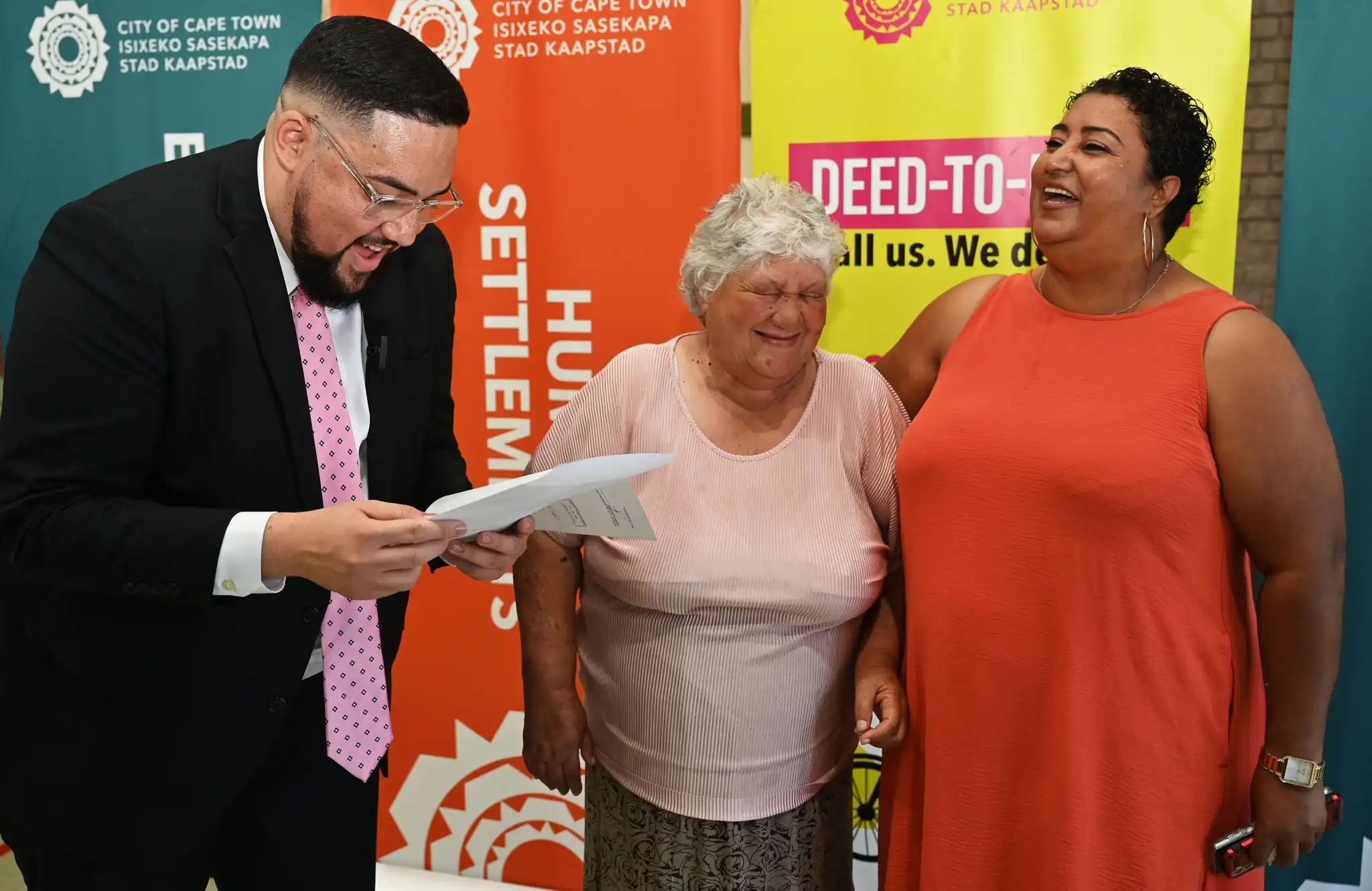 Councillor Carl Pophaim with Leonsdale Title Deeds recipients