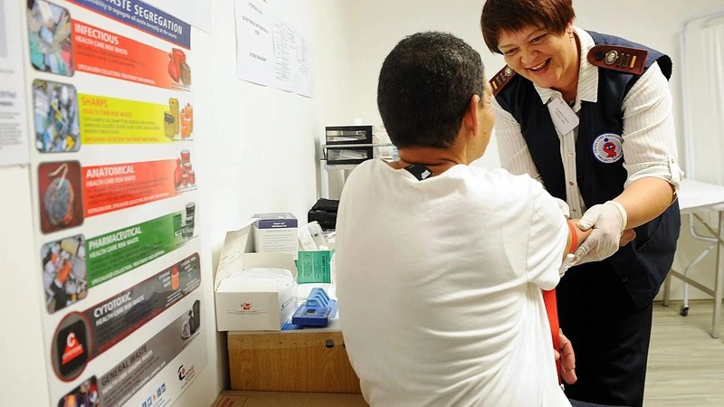 City Health Doctor checking blood pressure of a patient on the occasion of World Hypertension Day in Cape Town