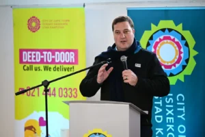 Mayor Geordin Hill-Lewis while giving title deeds to Kensington residents in Cape Town