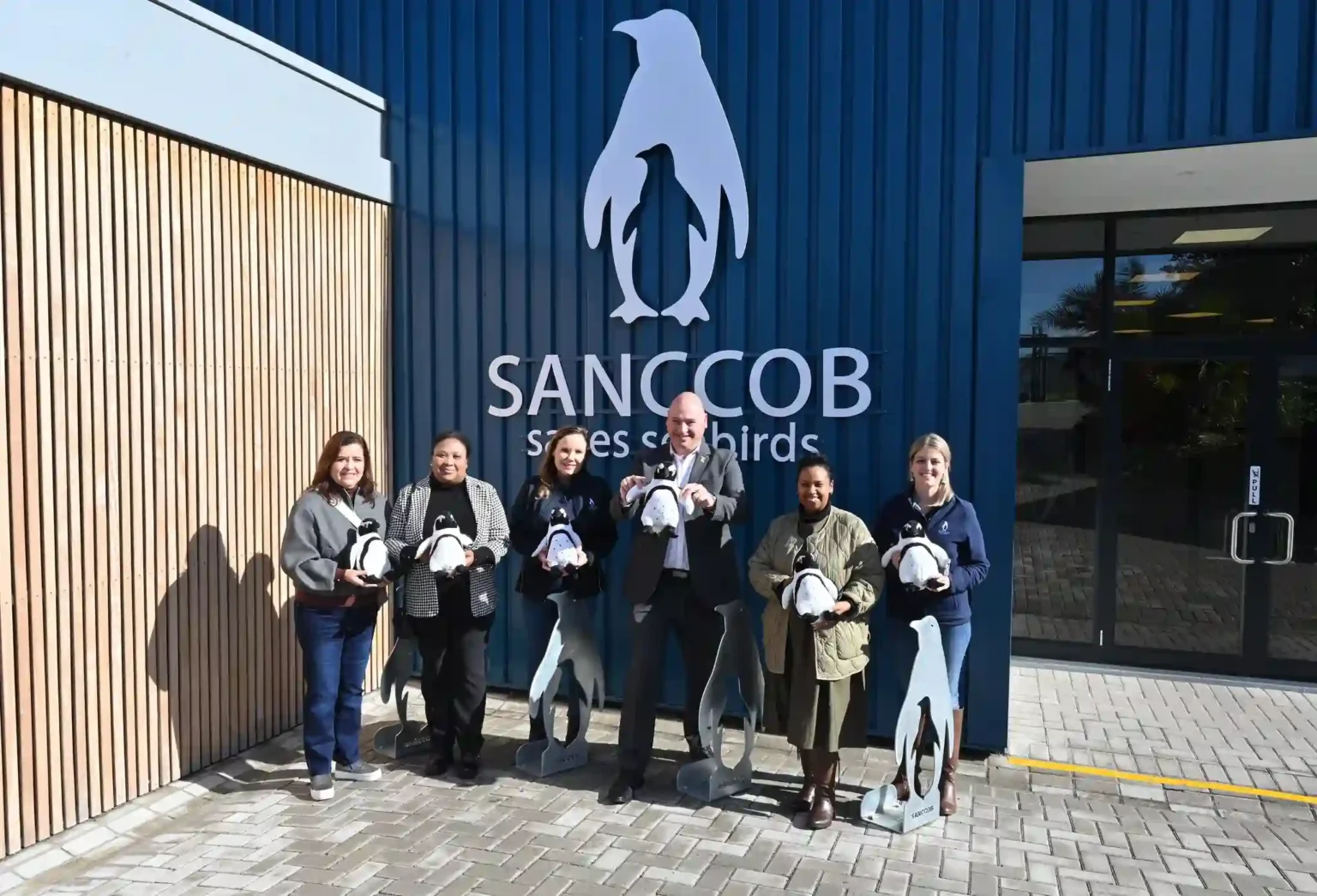 Alderman James Vos with SANCCOB team in Cape Town