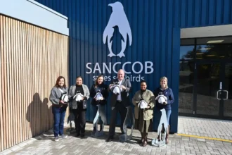 Alderman James Vos with SANCCOB team in Cape Town