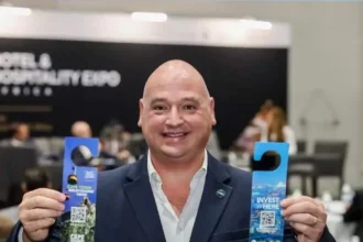 Alderman James Vos with newly designed 'Hang On, Pick Cape Town' campaign door hangers