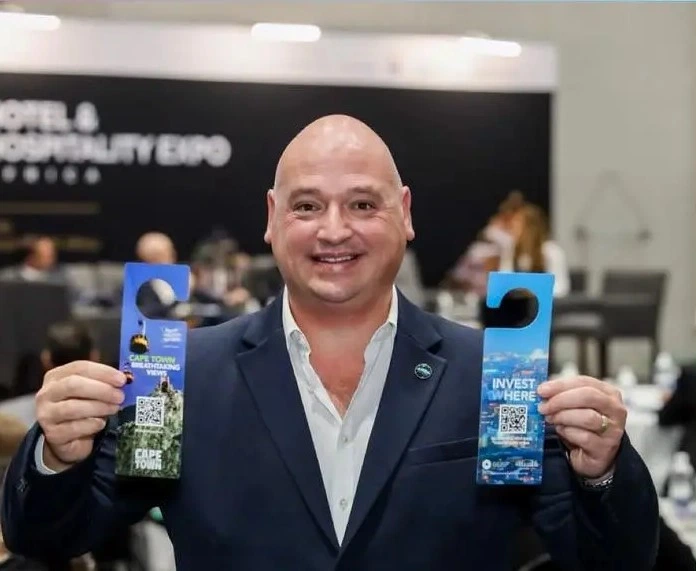 Alderman James Vos with newly designed 'Hang On, Pick Cape Town' campaign door hangers