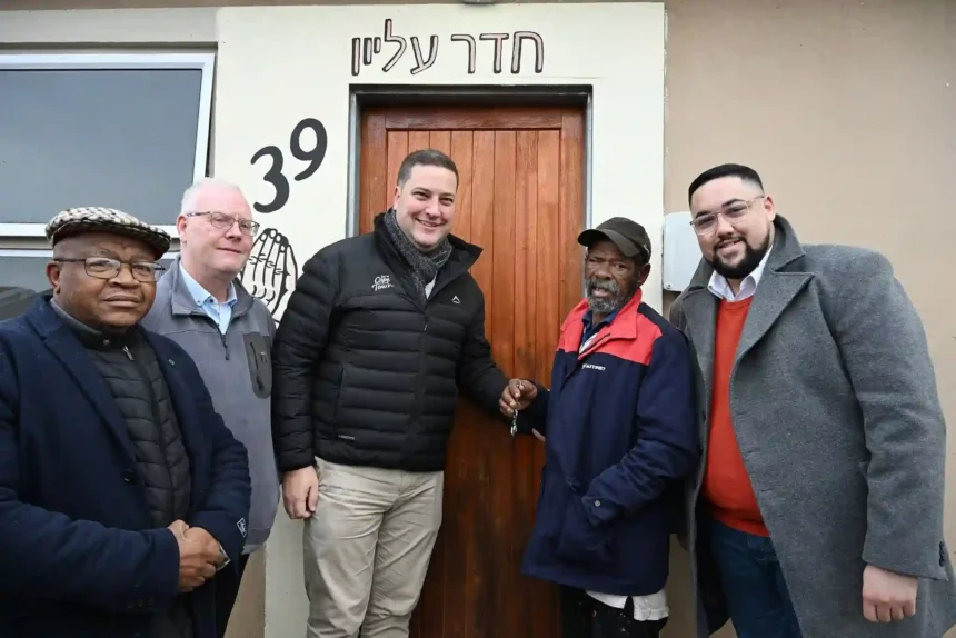 Mayor Geordin Hill-Lewis with Councillor Carl Pophaim handing over the Belhar Pentech House keys to the lawful beneficiary recipient in Cape Town