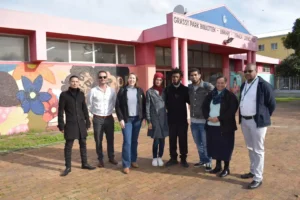 Community, Arts and Culture Development Department with Lead Artist Skumbuzo Salman while creating murals on city buildings in Cape Town