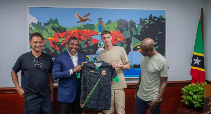 PM Terrance Drew with Cole Palmer, St. Kitts and Nevis