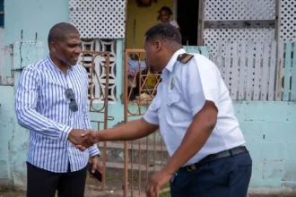 PM Terrance Drew meeting with an officer at Conaree visit in St. Kitts and Nevis