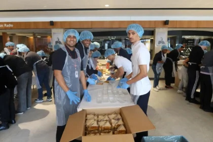 Mandela Day celebration , Capetonians while packing 3000 sandwiches for the children in need