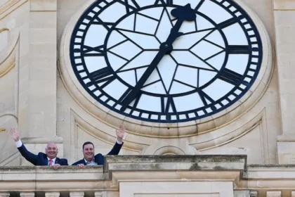 Mayor Geordin Hill-Lewis and Alderman James Vos posing at City Hall Clock, Cape Town