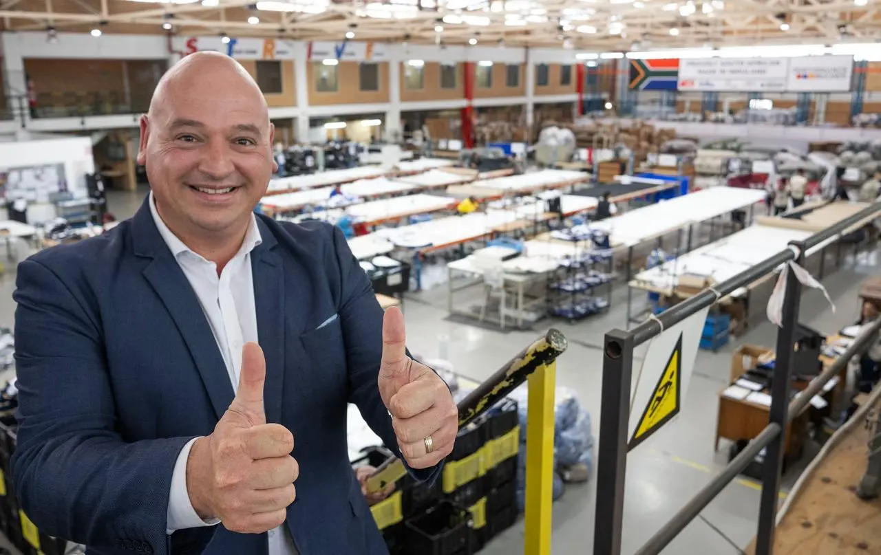 Alderman James Vos at a clothing factory in Cape Town