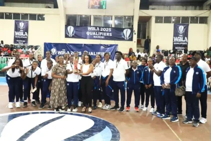 Kenya Ports Authority Women's Basketball Team while holding the trophy