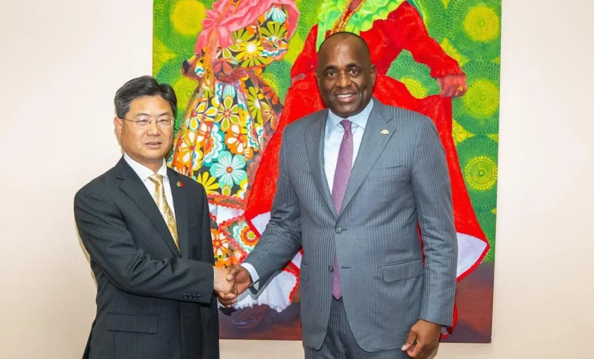 Ambs Chu Maoming with PM Roosevelt Skerrit for Dominica-China cooperation