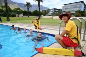 Mayor Geording Hill-Lewis with his team at community swimming pool in Cape Town