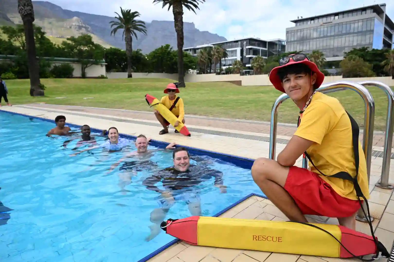 Mayor Geording Hill-Lewis with his team at community swimming pool in Cape Town