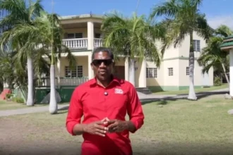 PM Drew in front of new SKNLP permanent headquarter in St. Kitts and Nevis