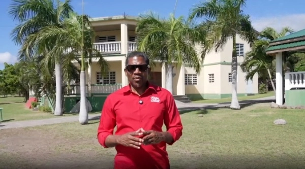 PM Drew in front of new SKNLP permanent headquarter in St. Kitts and Nevis