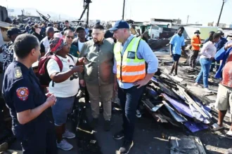 Mayor Lewis and Cllr Pophaim with the survivor of the fire incident at Dunoon Site-5 in Cape Town