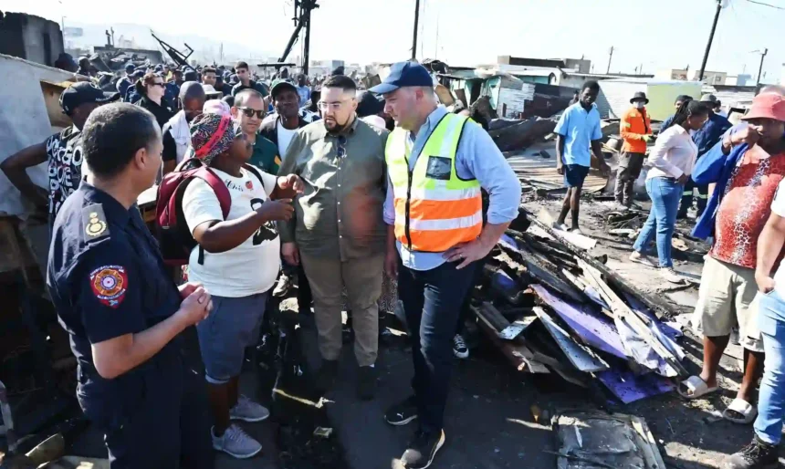 Mayor Lewis and Cllr Pophaim with the survivor of the fire incident at Dunoon Site-5 in Cape Town