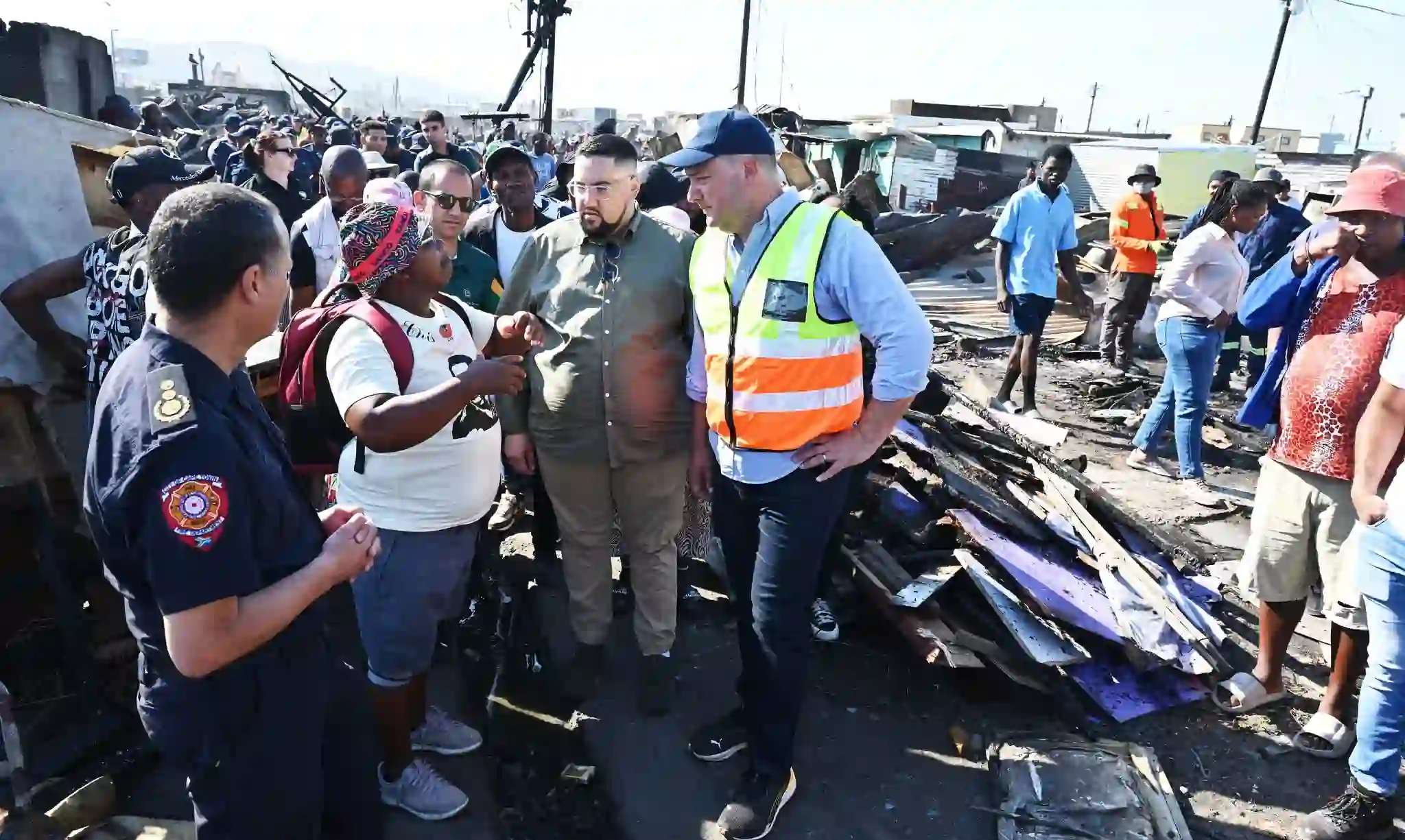 Mayor Lewis and Cllr Pophaim with the survivor of the fire incident at Dunoon Site-5 in Cape Town