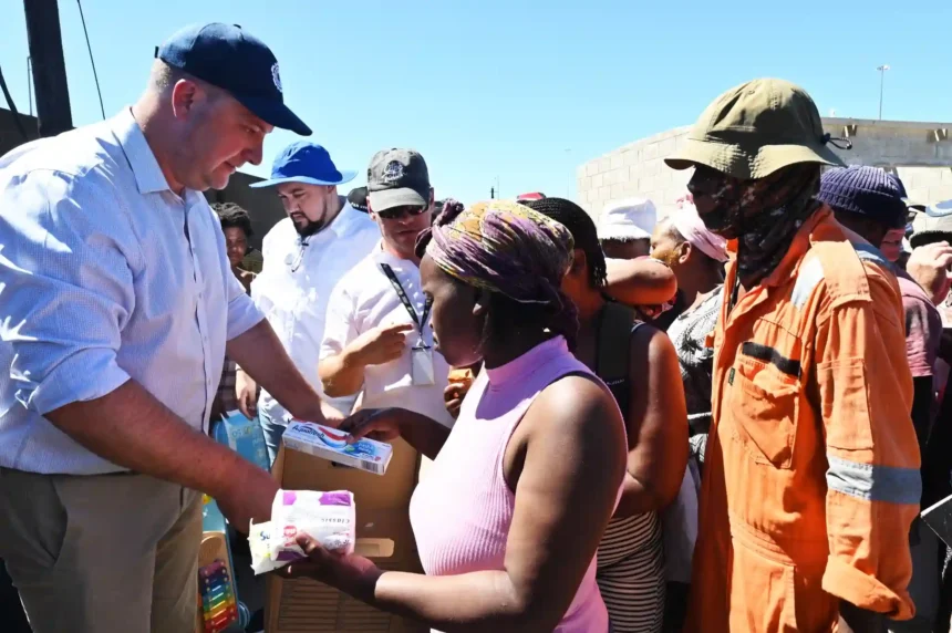 Mayor Geordin Hill-Lewis while providing service items to affected residents of Dunoon Site-5 in Cape Town