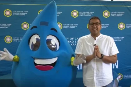 Councillor Zahid Badroodien with Water and Sanitation Mascot - Mzansi of Cape Town